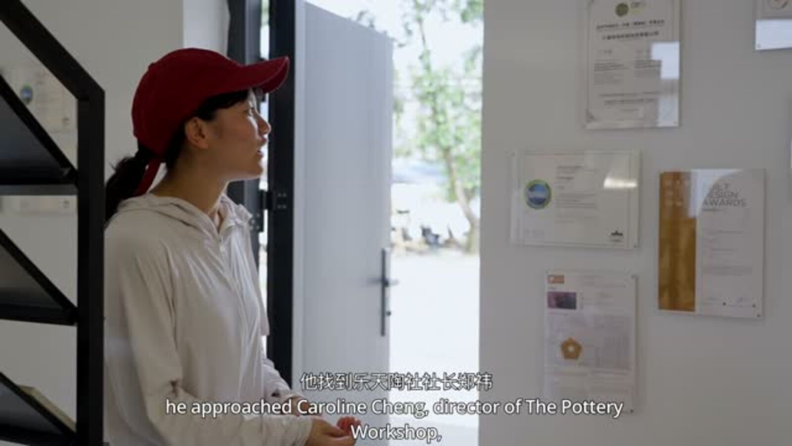 A visitor entering a Jingdezhen ceramics studio