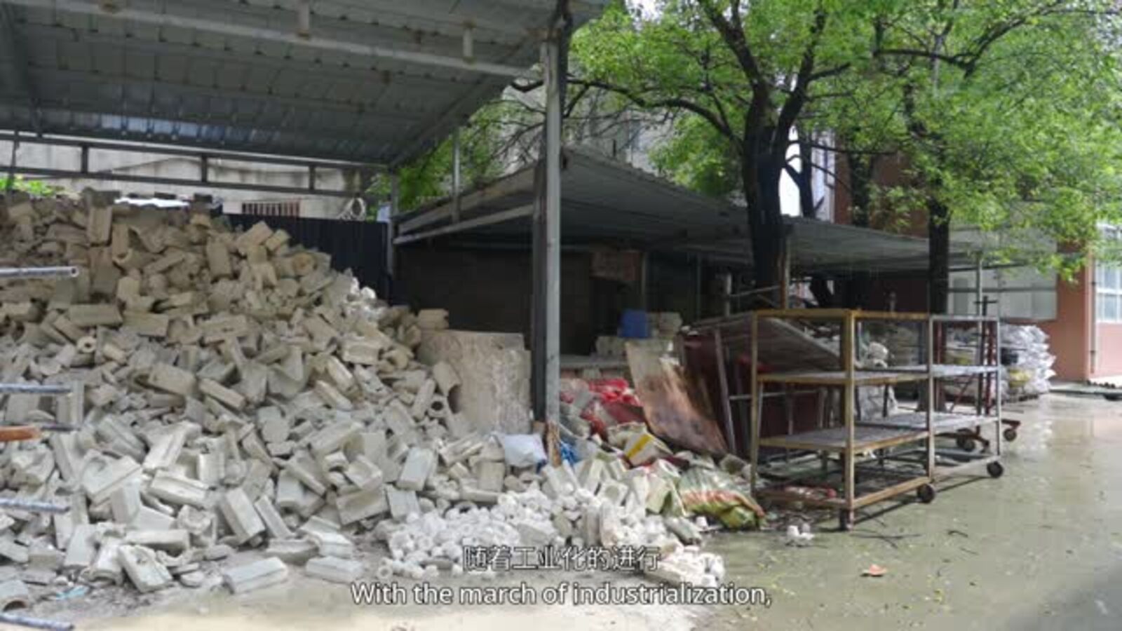Piles of discarded white porcelain outside a workshop in Jingdezhen